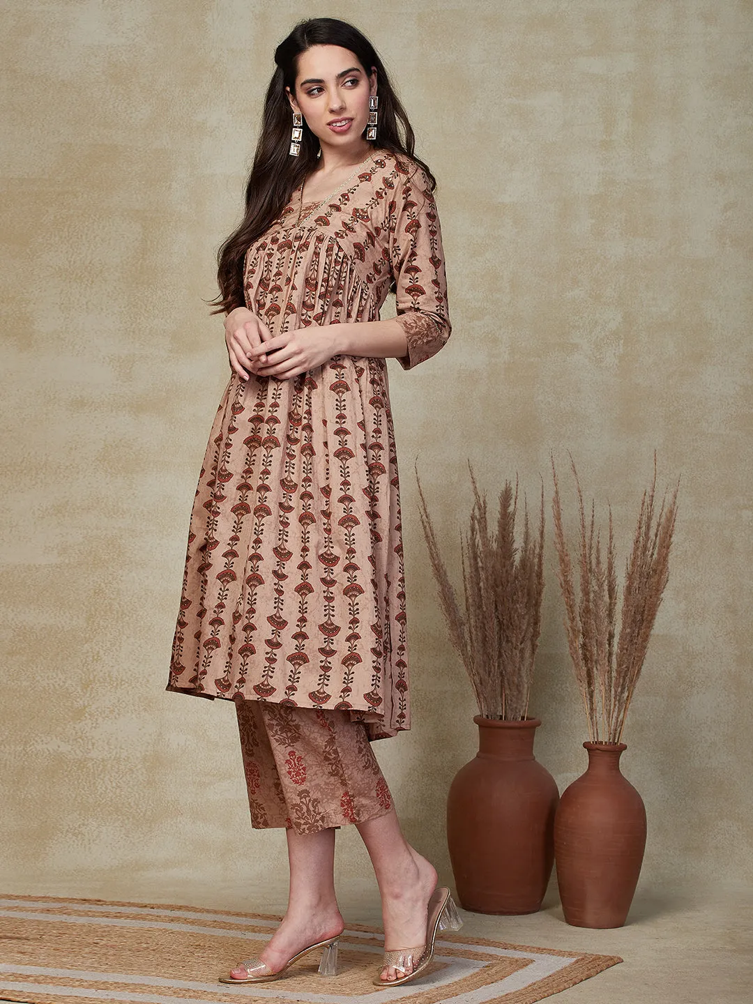 Ethnic & Stripes Printed & Embroidered A-Line Kurta with Pant - Brown